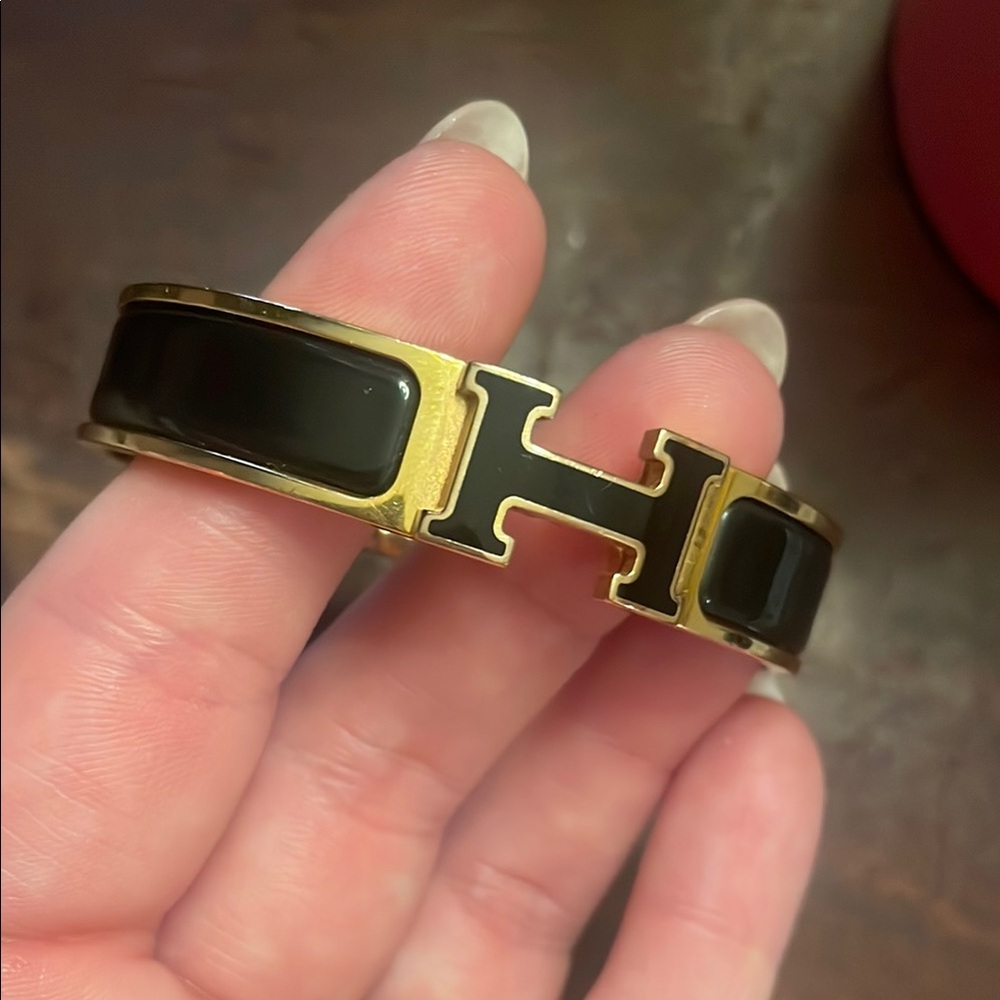 Hermès Black and Gold Cuff Bracelet